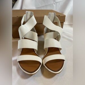 NWT. Cute white sandal. Short heel, stretchy straps. Size 8.5